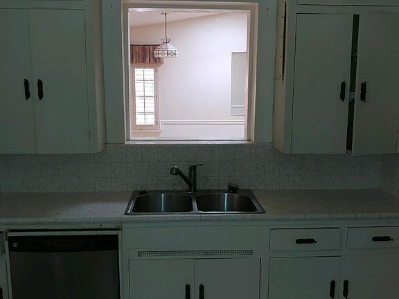Kitchen with pass thru to bonus room