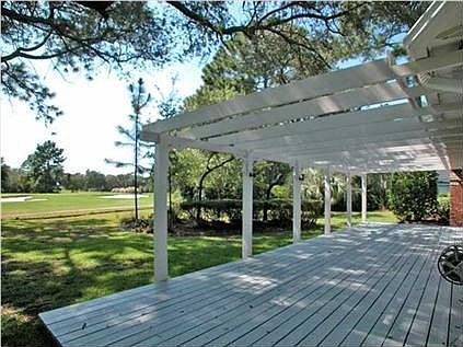 Rear deck and pergola overlooks golf course