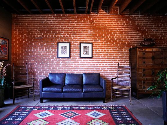 6. Living Room Couch & Red Brick Wall