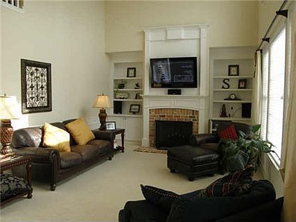 Two story family room with dramatic fireplace