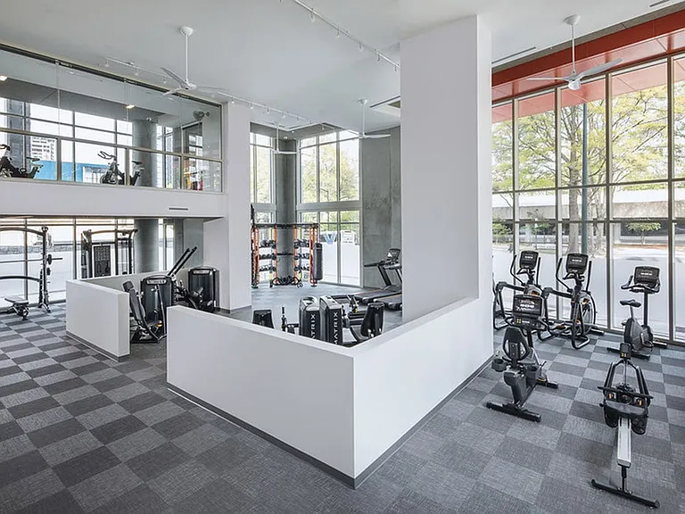 24/7 fitness center with cardio and strength training equipment
