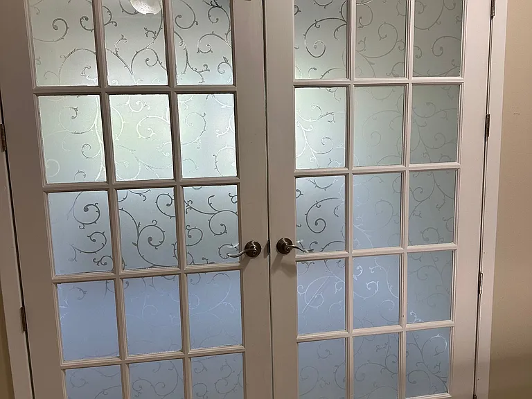 Beautiful French doors open to third room that can be used for a bedroom or office.