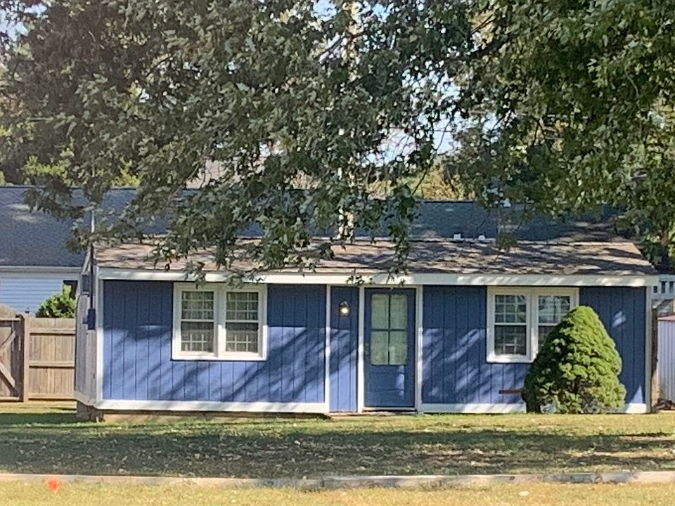 The little blue cottage just prior to completion. Trim boards now done near entry with new exterior entry light and new corner security light now installed.