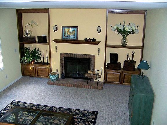 From Kitchen to Den, built-in Shelving & Wood-Burning Fireplace