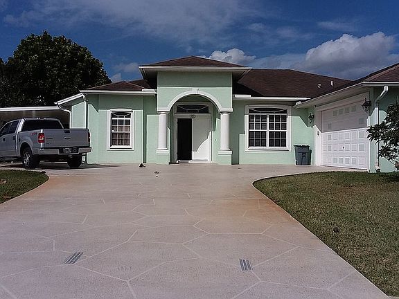 Front with 2 car garage