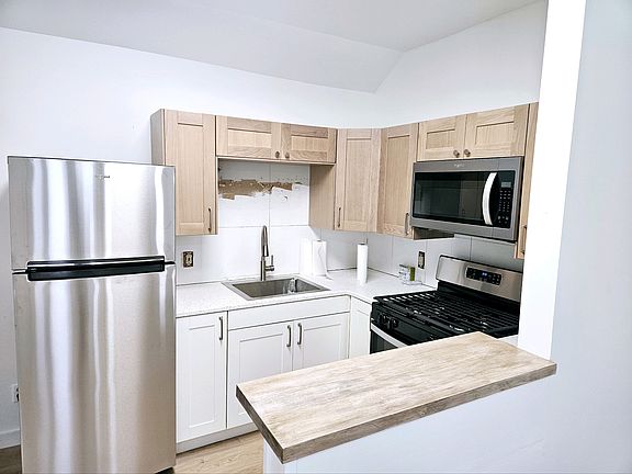 Kitchen before tile backsplash was installed.