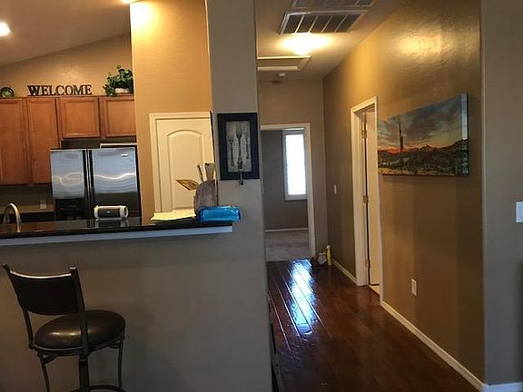 Hallway and view of kitchen from living room