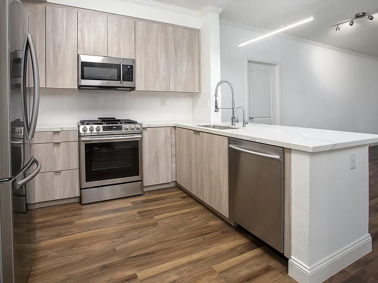 Kitchen with light finishes at Reveal Playa Vista in Playa Vista, CA.