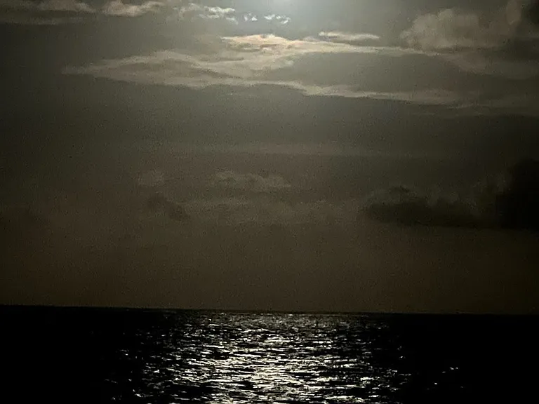 Moonbow reflected on the ocean