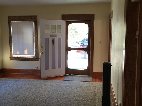 standing in dining area looking out the front door