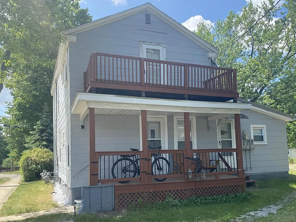 Rear of 19 Mead St. does offer limited off street parking. A back door is available for both lower units. The two story porch really adds some vital spring/summer living space with mature trees for shade and a lovely view in this very peaceful neighborhoo