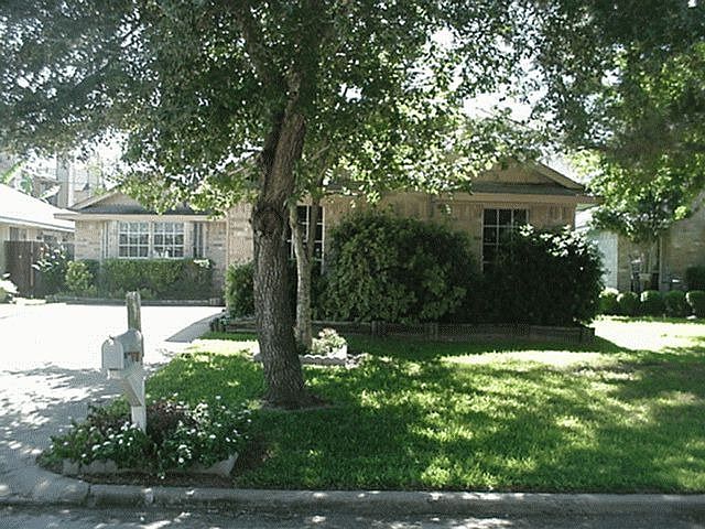 Mature trees and nice landscaping in front & entry