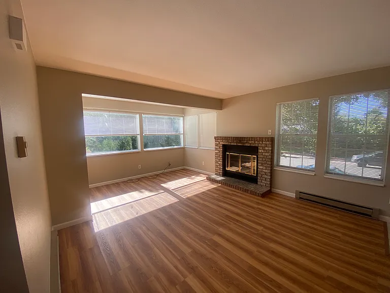 Living room with wood burning fireplace