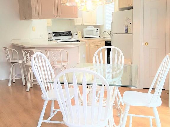 Kitchen with breakfast bar and eating area