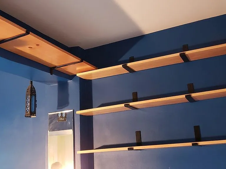 Custom solid wood shelves in bedroom