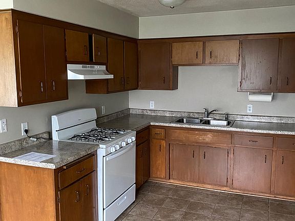 Kitchen stove, sink, and countertops