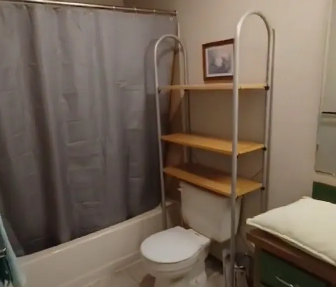 Full bathroom with washer and dryer. Bathroom is accessed through bedroom.
