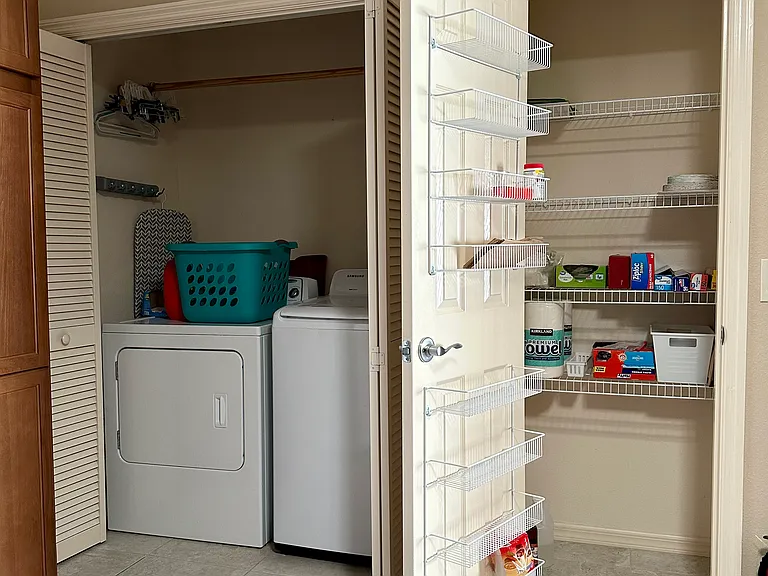 Washer and dryer plus utility closet.