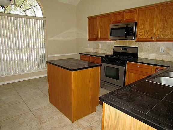 Another view of the kitchen. Notice the large arched window.