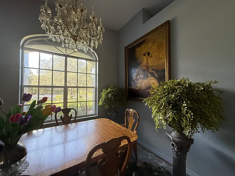 Dining Room with high ceiling faces front yard