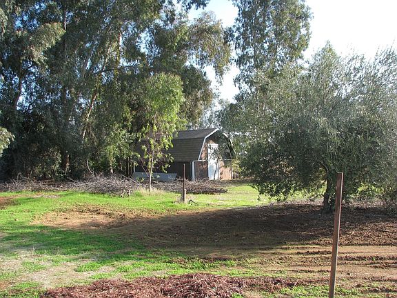 A shed at back corner