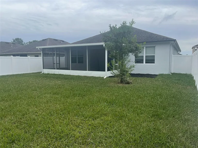 Spacious enclosed patio and fully fenced in yard overlooking conservation.