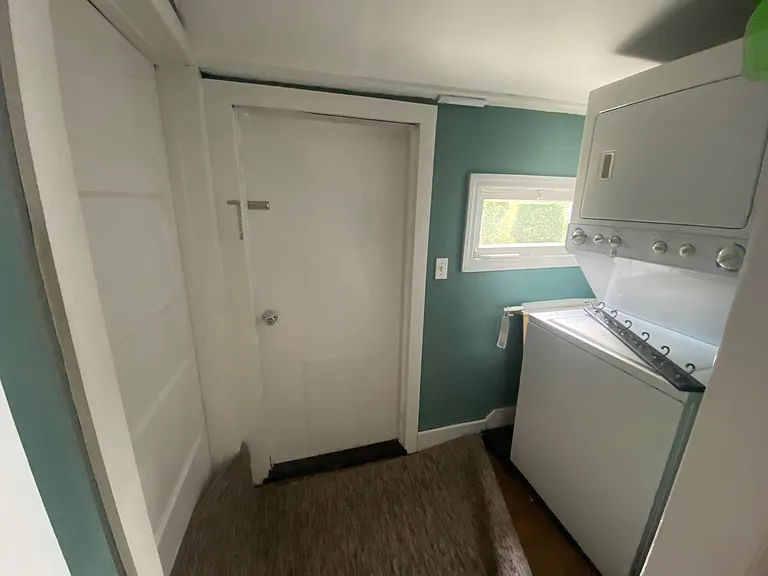 back mud room going to small patio. washer dryer unit