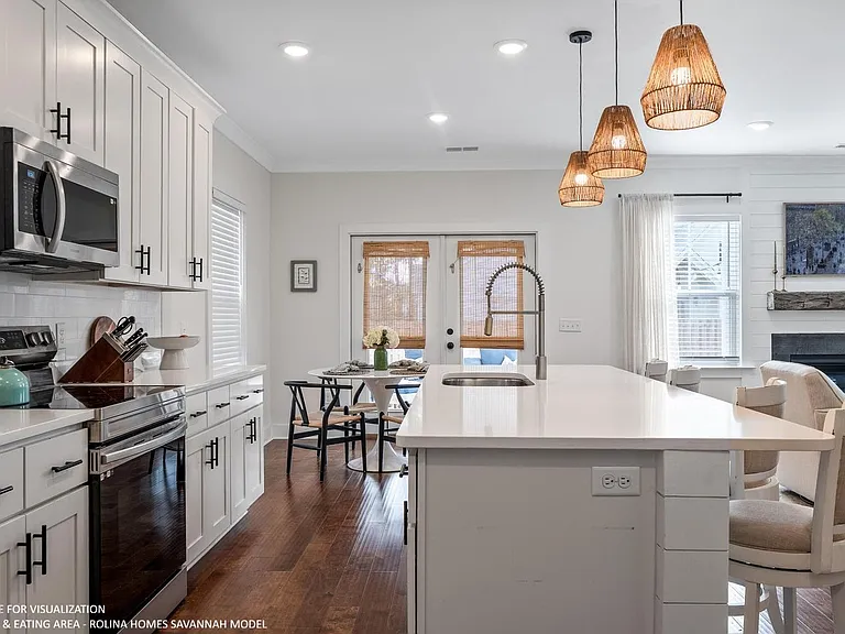 KITCHEN PICTURE FROM A DIFFERENT SAVANNAH MODEL RECENTLY BUILT BY ROLINA HOMES