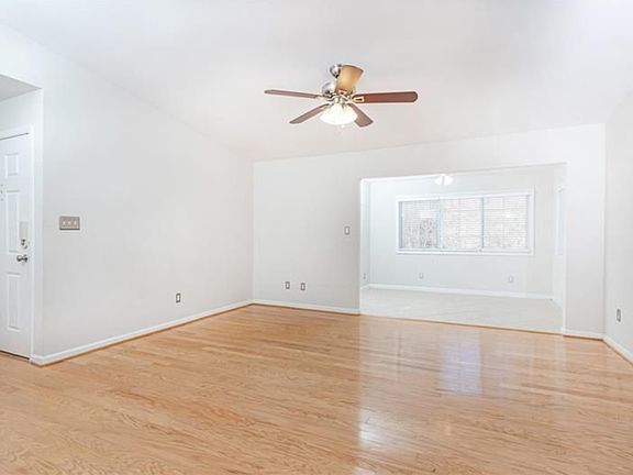 living room with sunroom in background