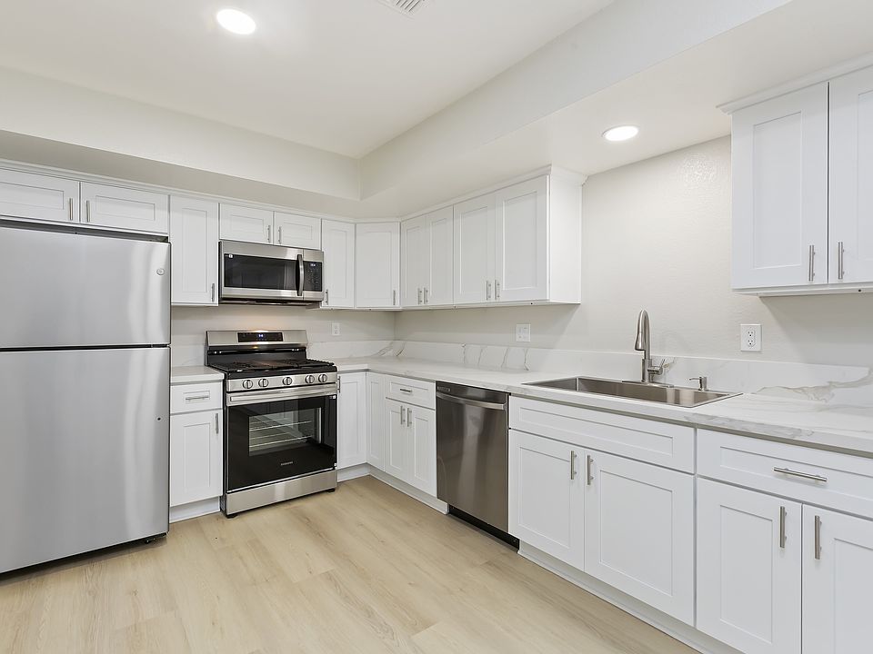 White shaker cabinetry with quartz countertops!