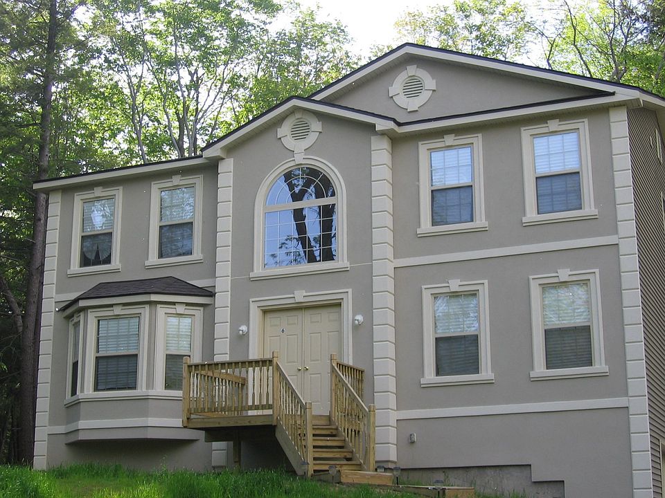 Stucco Beauty in Private Lake Community!