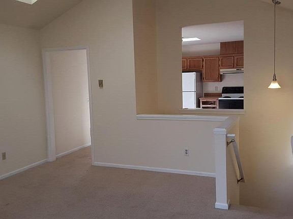 from balcony door looking across living room into kitchen