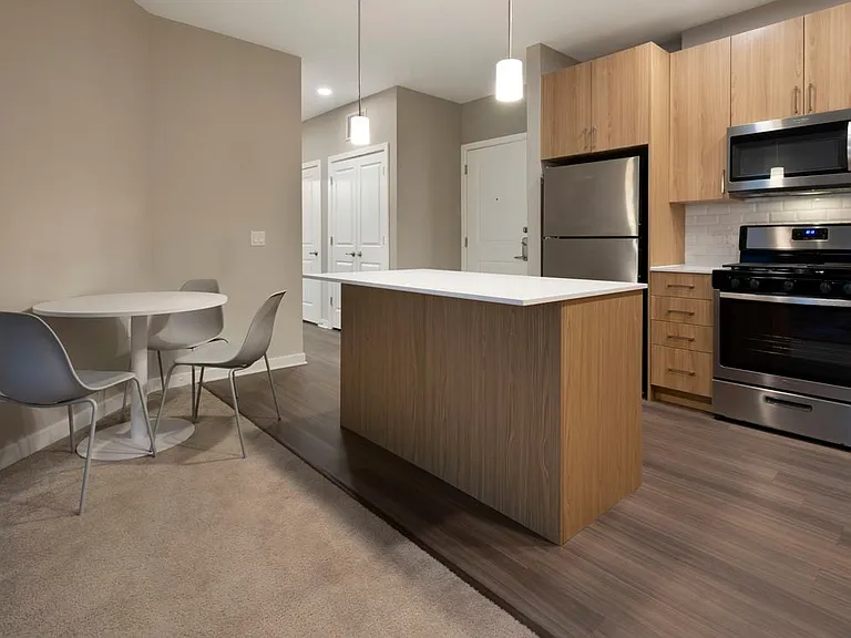 Furnished+ apartment homes include a dining set (Representative Image exact items and style of furnishings may vary)