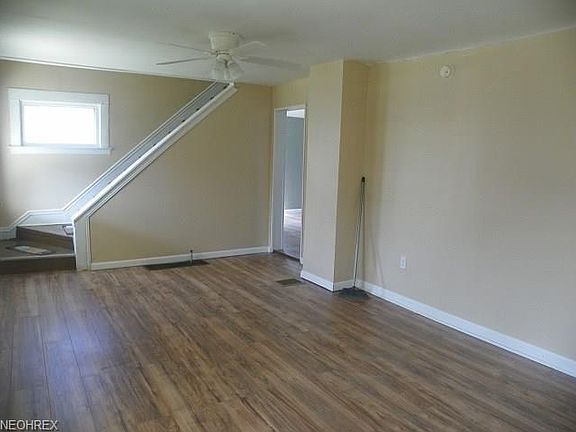 large newly painted living room with laminate flooring