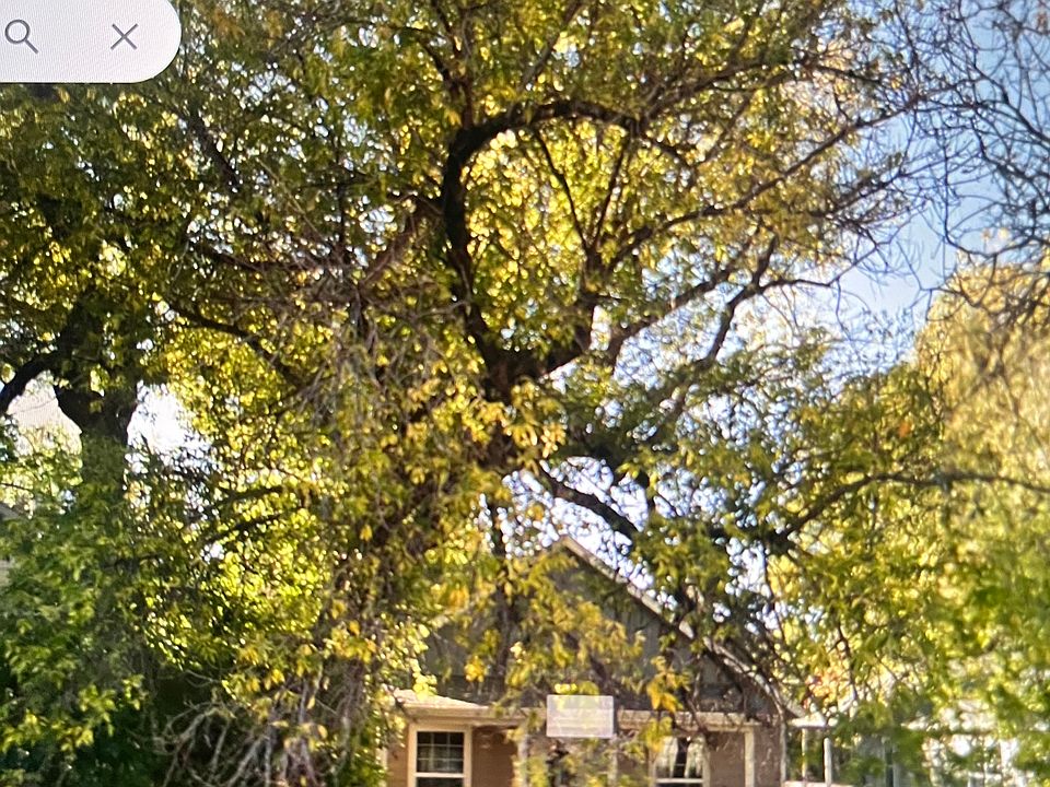 Front street view with view of porch for 111 N. Broadway Avenue, Bozeman, Montana.