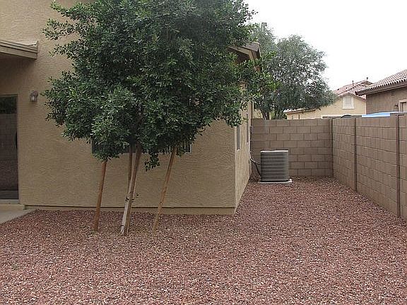 side yard, A/C from rear