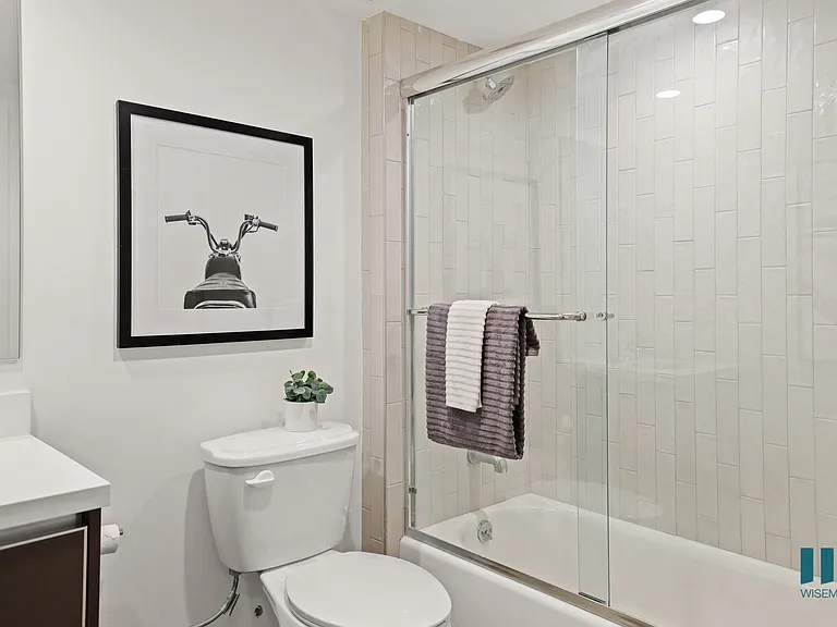 Bathroom with Full-Size Bathtub with Glass Door