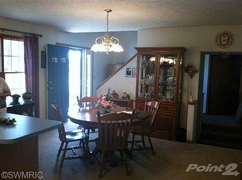 This Open Concept Formal Dining Room provides the perfect spot for entertaining guests and following up a good meal with family game night!