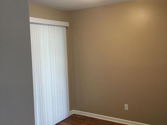 Spacious dining area off kitchen leading to covered porch