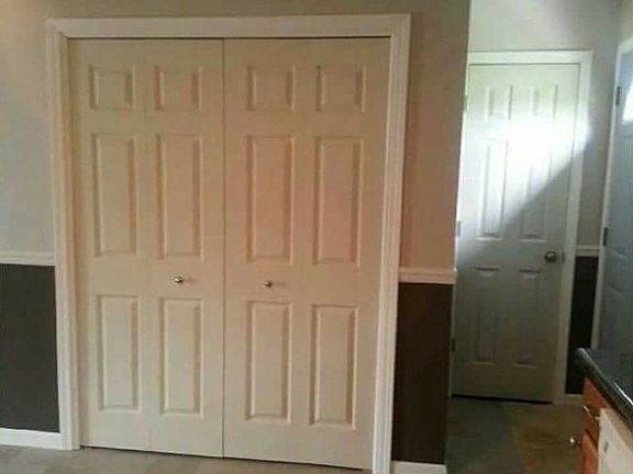 Washer/dryer hookups behind two panel door and pantry at the