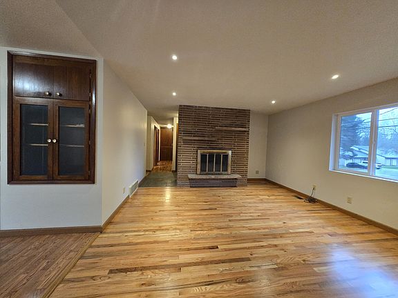 Open living space flows into the dining room to the left of picture. Bedrooms and bath are straight ahead.