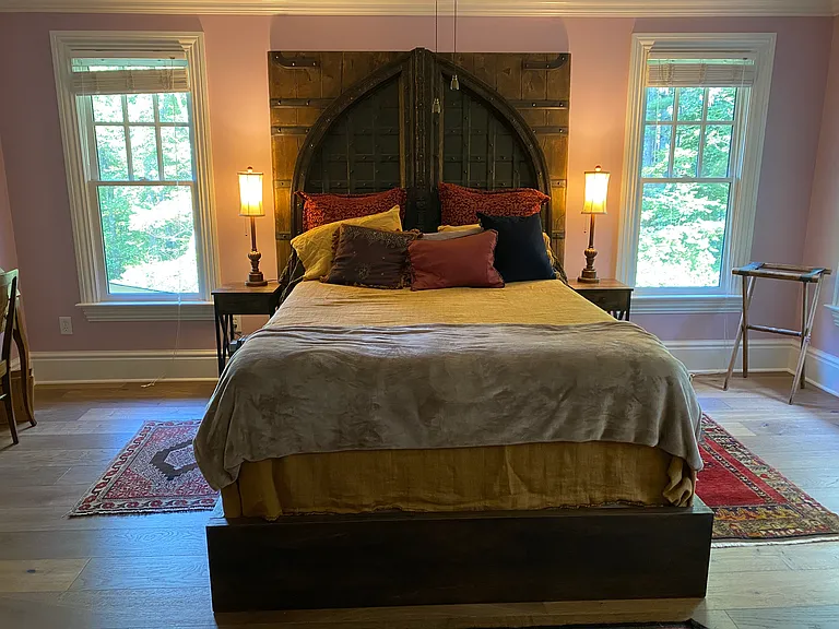 Elegant queen size bed with designer linens