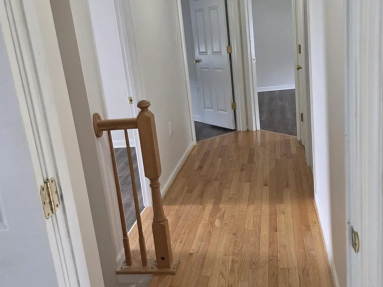 upstairs hallway looking out from master to other 3 bedrooms