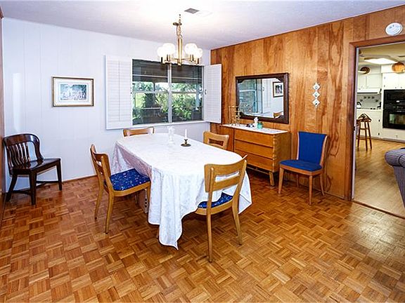 Large formal dining area with original parquet wood floors