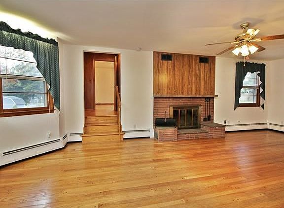 The wood burning fireplace is the focal point of the living room.  All hardwood flooring on the main level.