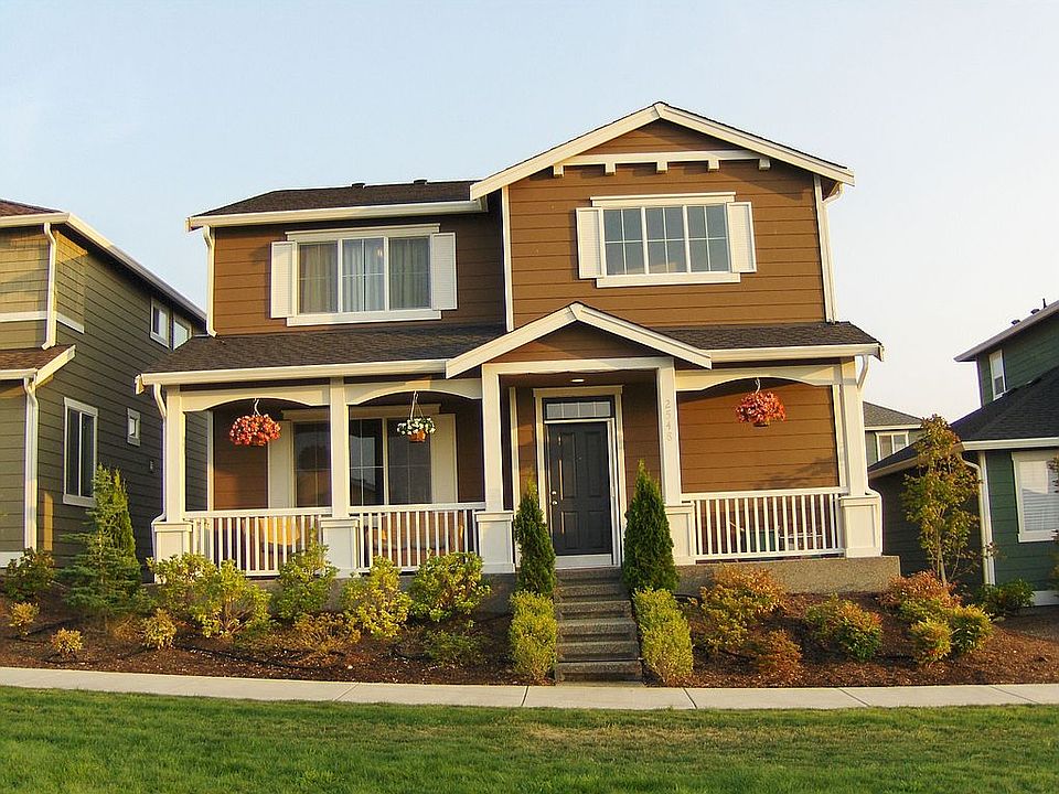 Front door just steps away from beautiful grass park maintained by community