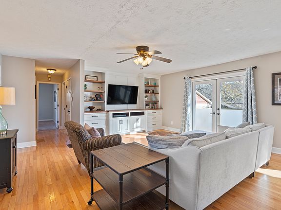 Bright and open living area with custom built-in cabinetry