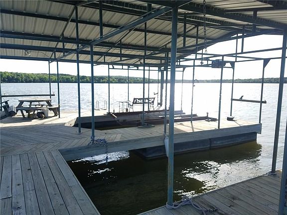 Two boat slips, one with a lift.