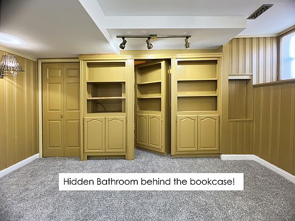 Secret hidden bathroom behind the bedroom bookcase!