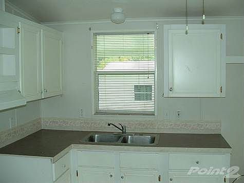 WINDOW OVER STAINLESS SINK